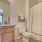well lit bathroom with shower/tub combo